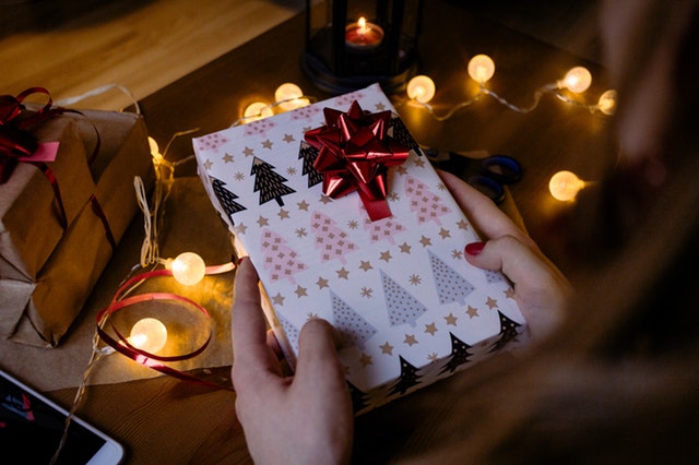 person-holding-gift-box-with-red-ribbon-beside-string-lights-1687049 (1) person-holding-gift-box-with-red-ribbon-beside-string-lights-1687049 (1)